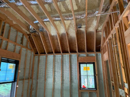 spray foam insulation of interior of the first floor of a home