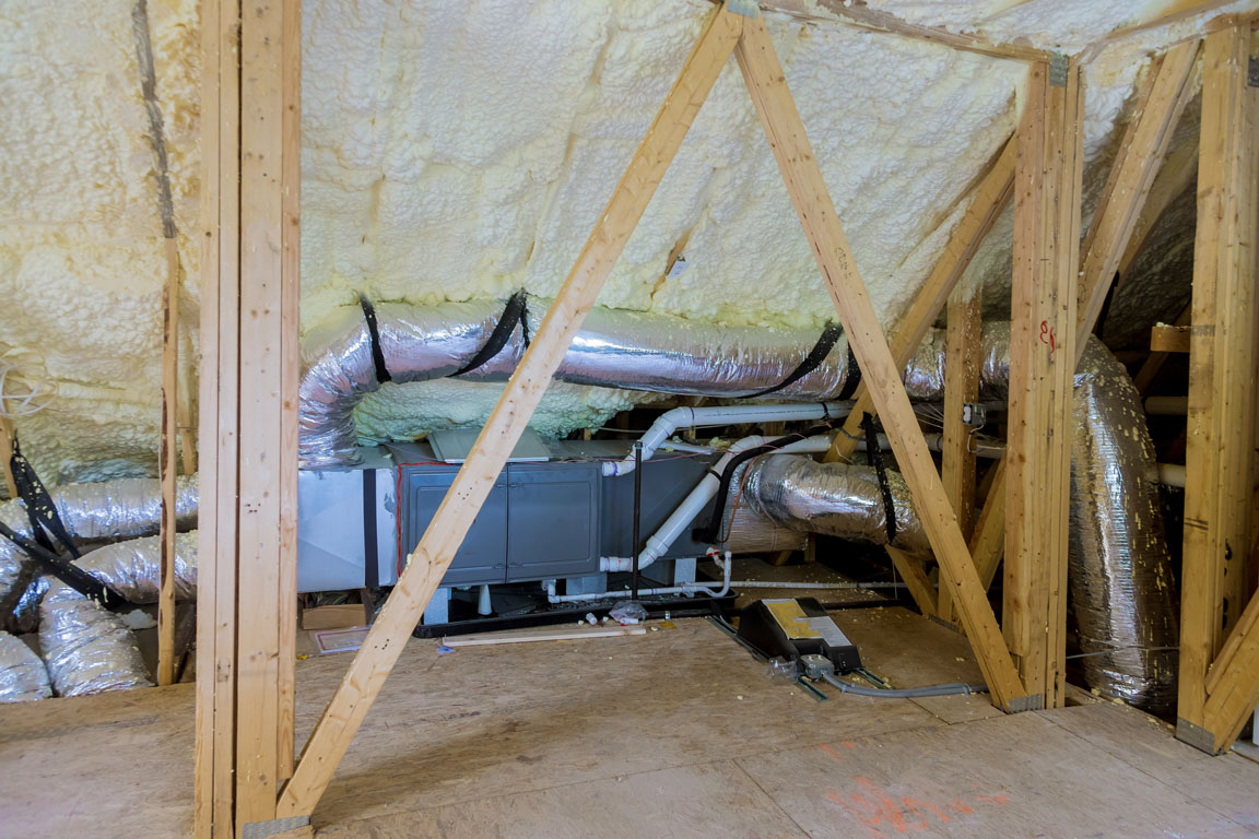 spray foam insulation application near HVAC system