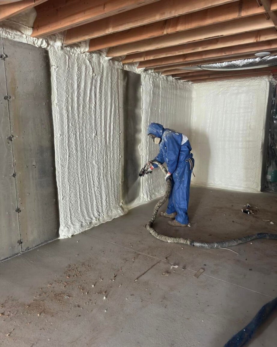 basement spray foam insulation being applied