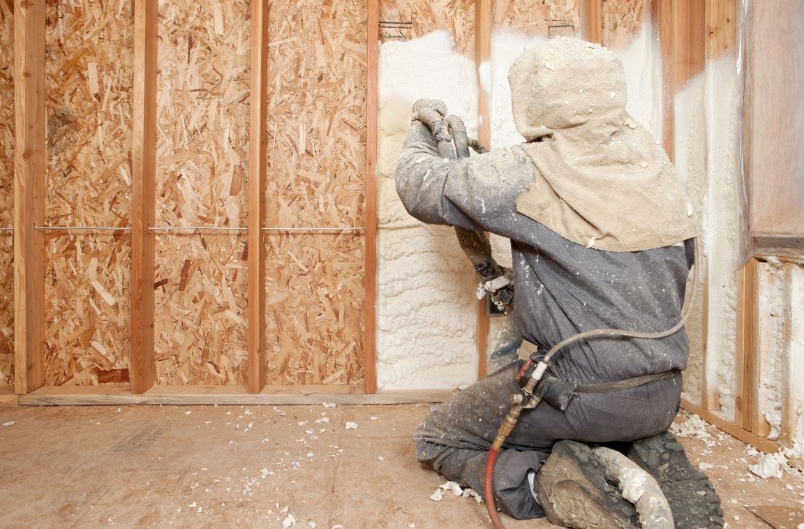 spray foam insulation insulation expert installing spray foam installation in a home